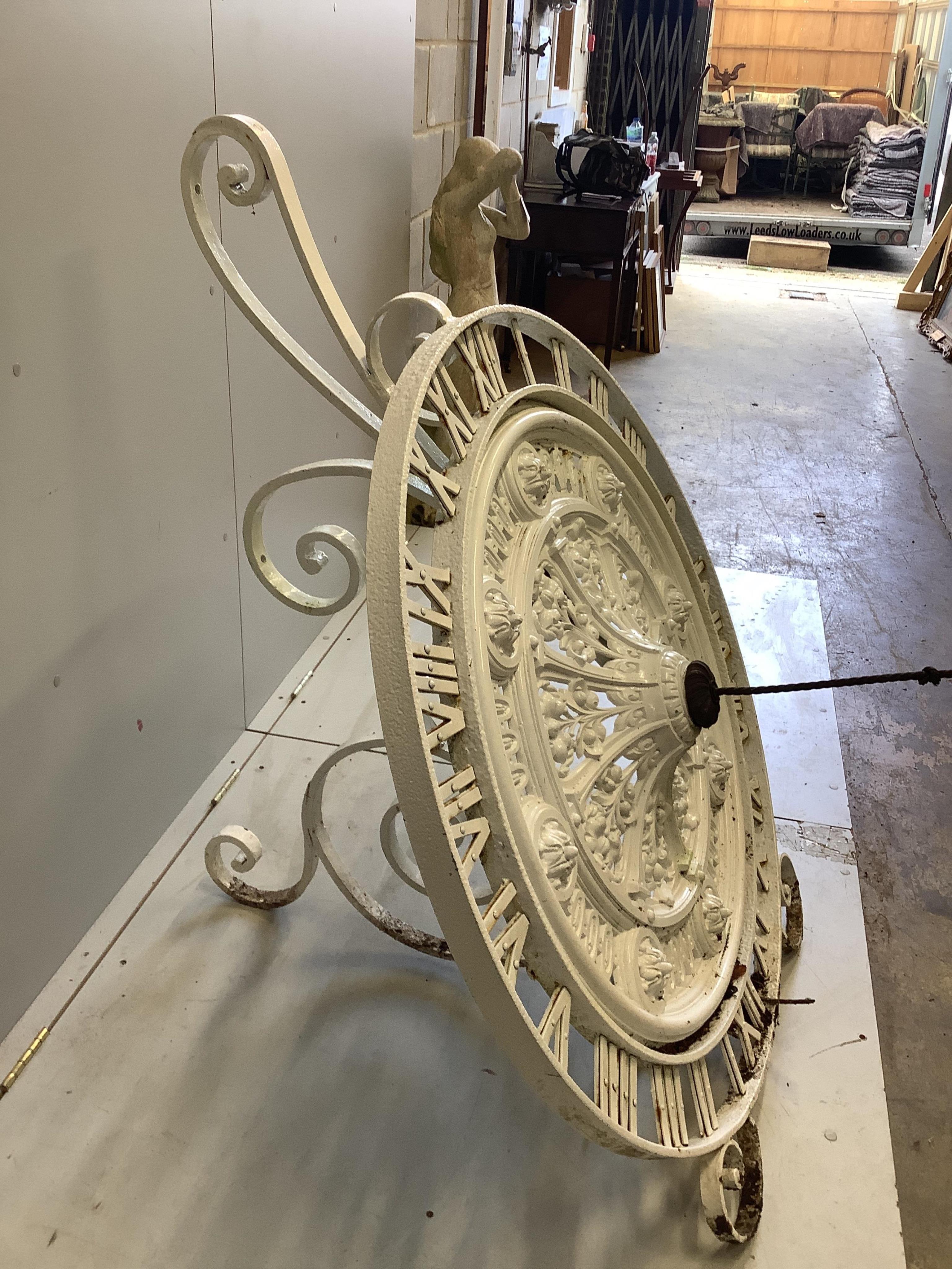 A modern white painted cast iron ‘’clock’’ sundial, height 120cm. Condition - fair